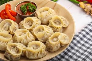 Steamed Nepali dumpling Momo with sauce photo