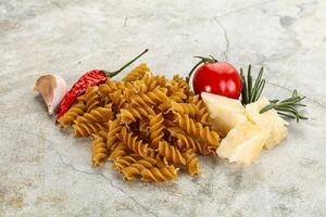 Raw whole grain pasta fusilli photo