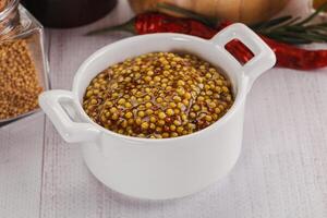 Spicy mustard sauce with seeds photo