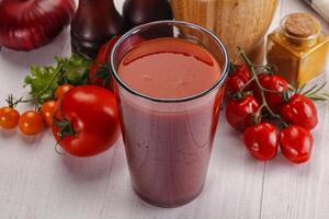 Fresh Tomato juice in the glass photo