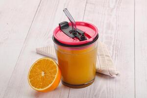 Sweet fresh orange juice in the glass photo