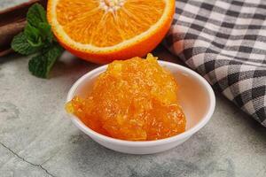 Tasty homemade Orange jam in the bowl photo