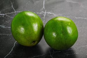 Two ripe green exotic avocado fruit photo