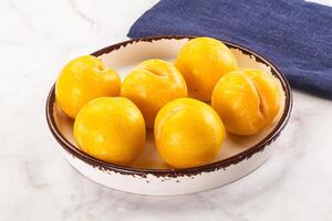 Ripe sweet and juicy Yellow Plums photo