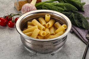 Italian cuisine - cooked pasta tortiglioni photo