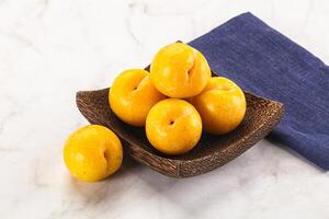Ripe sweet and juicy Yellow Plums photo