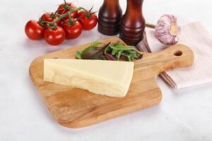 Piece Italian hard parmesan cheese photo