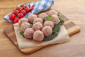 Raw pork meatball for cooking photo