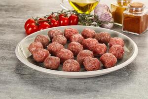 Uncooked raw beef meatball minced photo