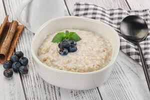 Oats porridge with blueberry photo