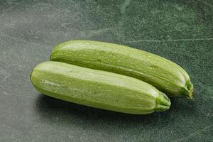 Raw green ripe zucchini vegetable photo