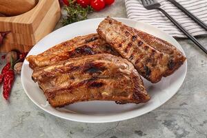 Grilled pork ribs with spices photo