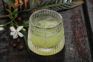 Alcohol limoncello drink in the glass photo