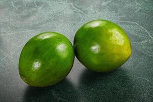 Two ripe green exotic avocado fruit photo