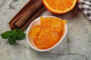 Tasty homemade Orange jam in the bowl photo