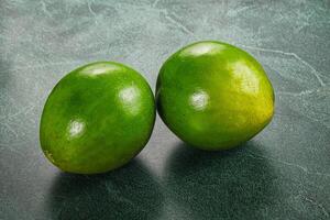 Two ripe green exotic avocado fruit photo