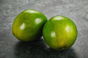 Two ripe green exotic avocado fruit photo