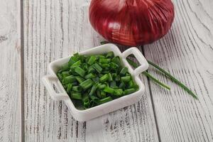 Diced green onion in the bowl photo