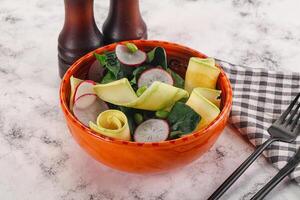 Green salad with zucchini and spinach photo