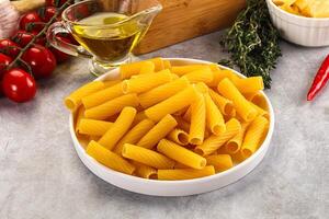 Italian cuisine - dry tortiglioni pasta photo