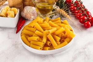 Italian cuisine - dry tortiglioni pasta photo