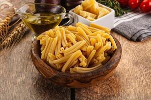 Raw dry Italian pasta - casarecce photo