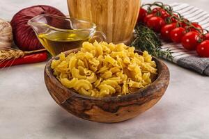 Raw dry Italian pasta Gallo photo