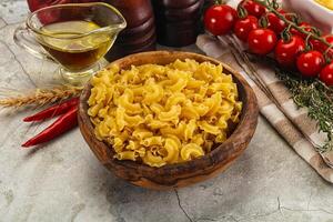 Raw dry Italian pasta Gallo photo