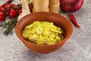 Italian cuisine - yellow risotto with chicken photo