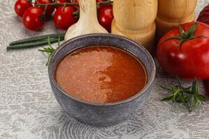 Hot tomato soup with diced chicken photo