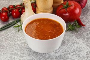 Hot tomato soup with diced chicken photo