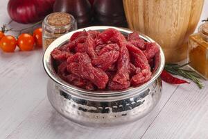 Raw beef meat - sliced strips photo