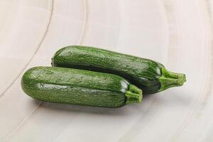 Raw green ripe zucchini vegetable photo