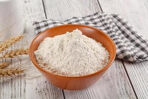 Wheat flour heap for bake photo