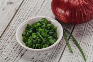 Diced green onion in the bowl photo