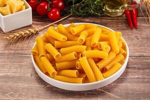 Italian cuisine - dry tortiglioni pasta photo