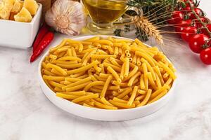 Italian pasta Maccherony for cooking photo