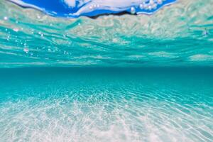Tropical transparent ocean with sandy bottom underwater photo