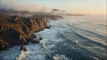 an aerial view of a cliff overlooking the ocean photo