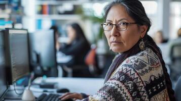 Focused Woman in a Modern Office photo
