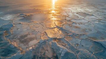 The sun reflects on the icy ground, creating a beautiful natural landscape photo