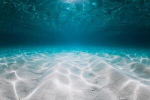 Tropical ocean with white sandy sea bottom underwater. Sea texture background photo