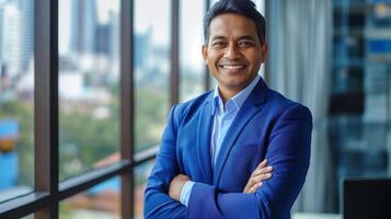 Confident Businessman in Blue Suit Smiling at Office Window - Professional Corporate Portrait photo