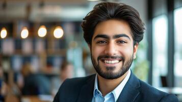 Professional Middle Eastern Man Smiling in Modern Office Setting, Business Portrait, Corporate Headshot for Professional Use photo