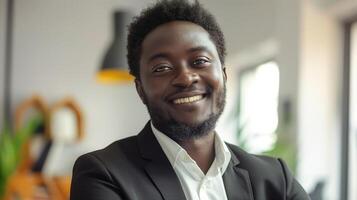 Confident African Man in Business Suit Smiling, Modern Office, Professional Atmosphere, Diverse Workforce, Bright Daylight, Urban Environment photo