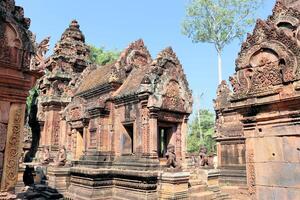 Temples and sculptures in Cambodia in the jungle photo