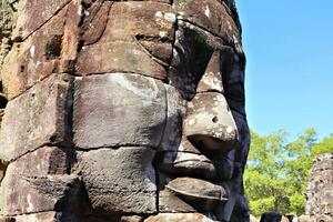 Bayon temple in Cambodia, faces of unknown deities photo