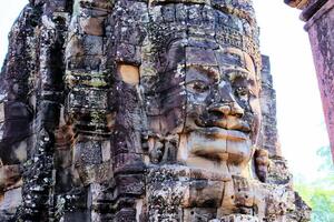 Bayon temple in Cambodia, faces of unknown deities photo