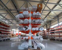 warehouse interior with shelves, pallets and boxes photo