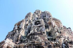 Bayon temple in Cambodia, faces of unknown deities photo